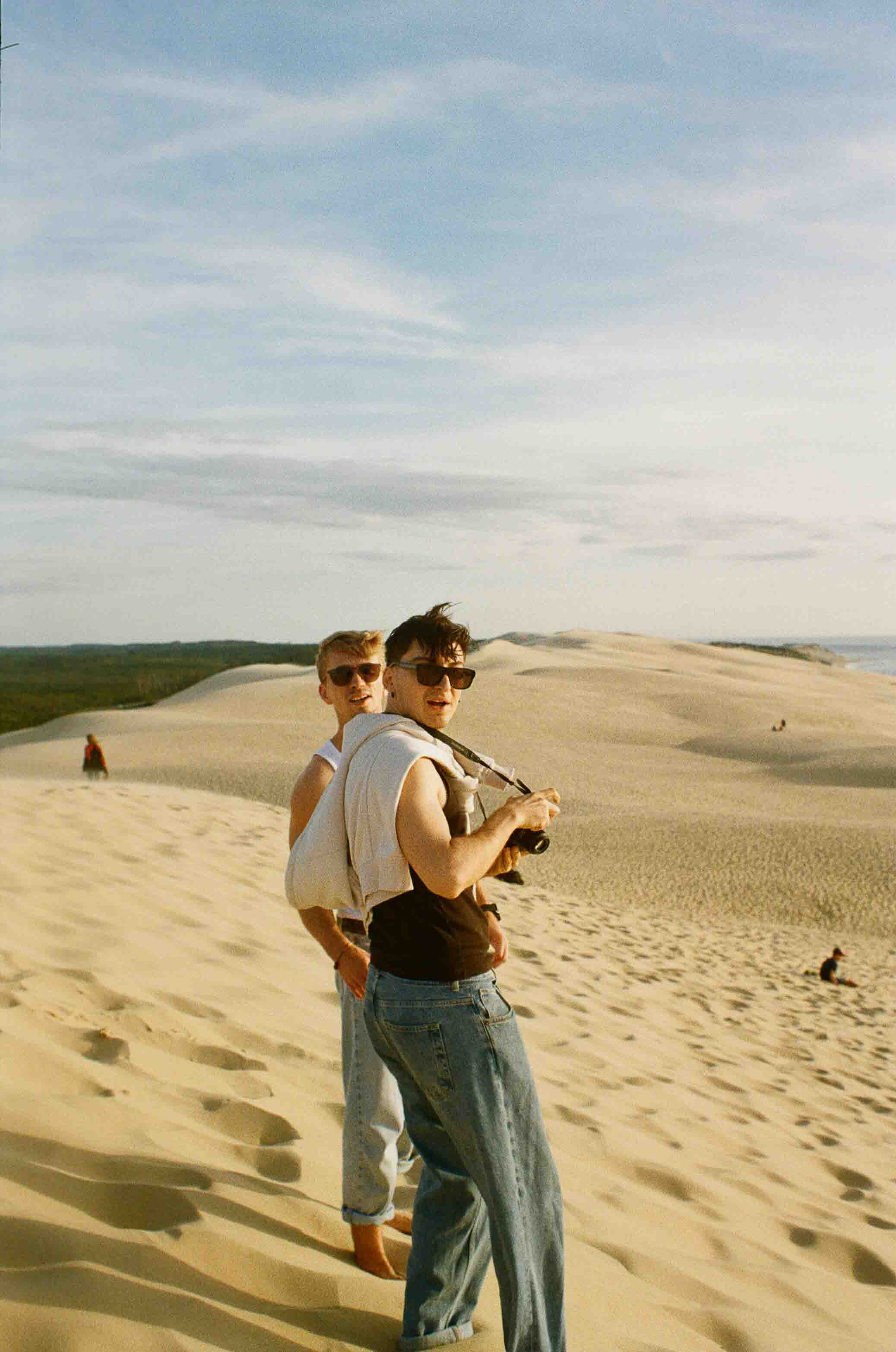 Friends sharing a memory in the sand dunes
